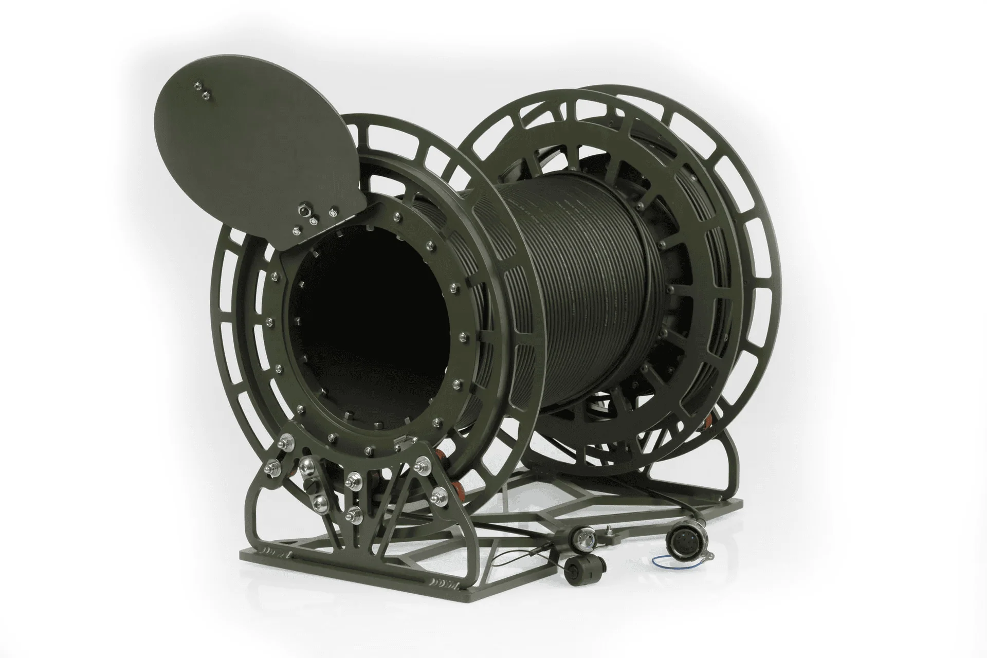 A detailed product shot of a large, olive-green military-grade cable dispenser with a central reel of thick, black cable. The hinged side cover is open, and the entire unit rests on a sturdy metal frame.