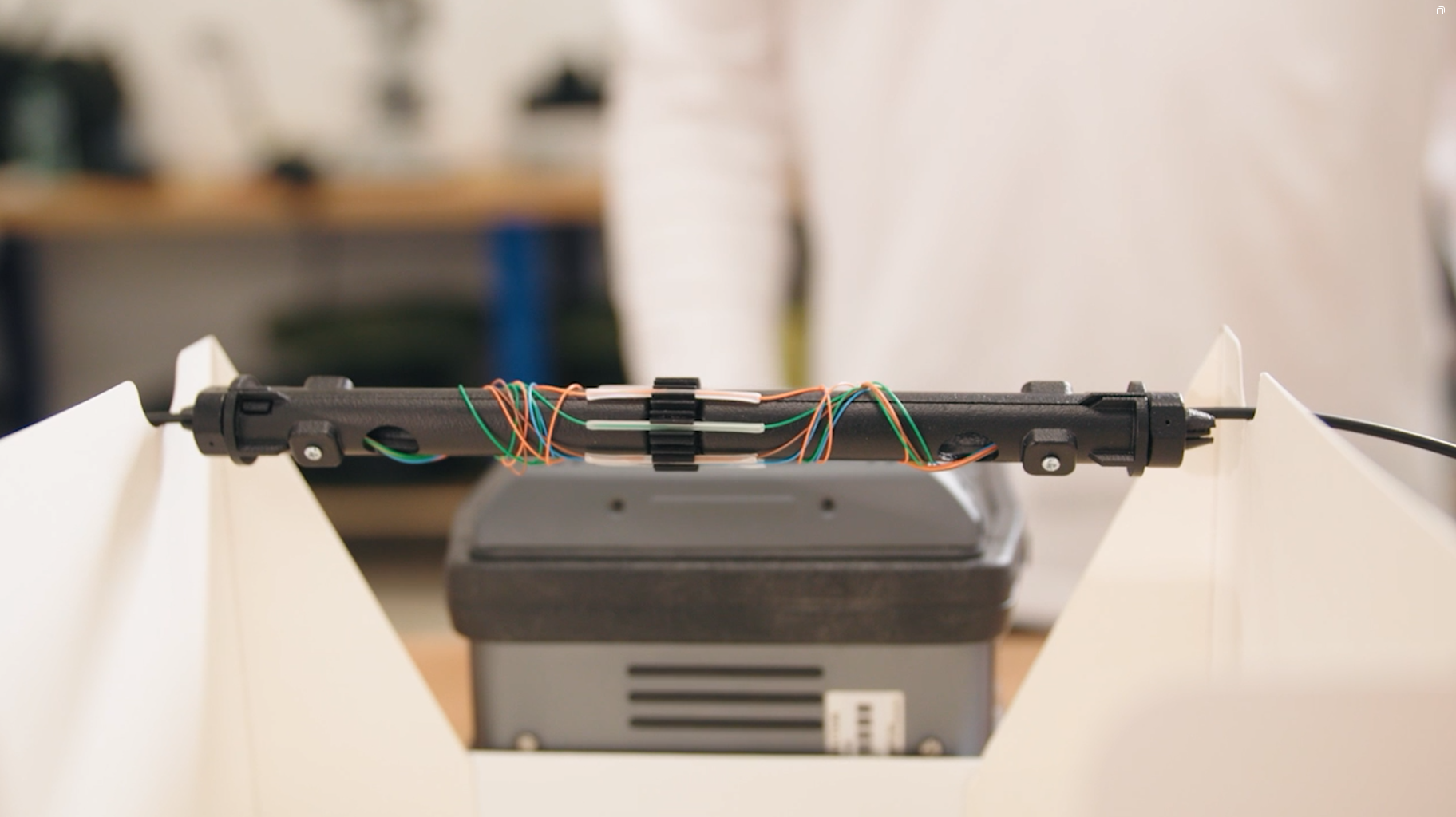 Alker Fibre Optic Engineer splicing a multi-core fibre in their workshop in England.